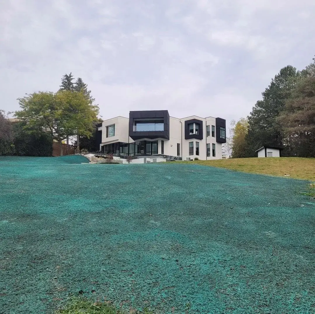 Modern home overlooking a freshly hydroseeded lawn